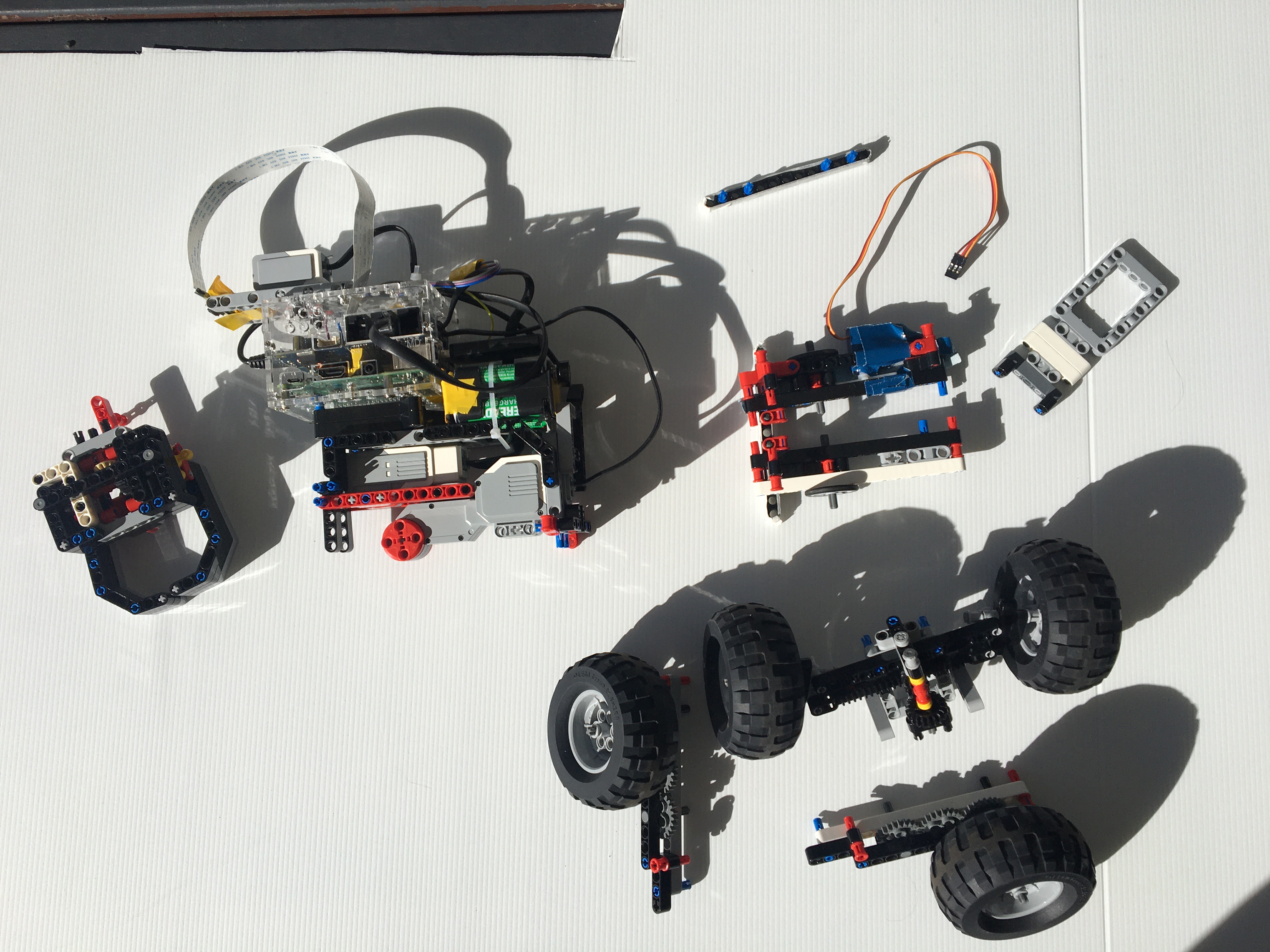 The claw, steering, pivot and plain ol' wheel attachments laid out on a white background.